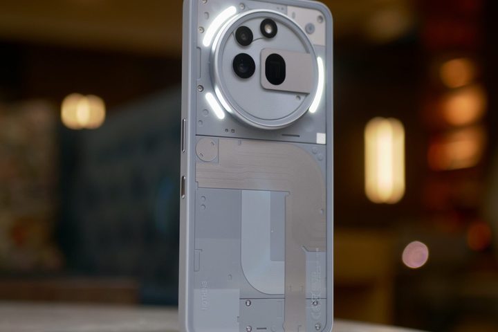 The back of the Nothing Phone 3a Pro, with the Glyph Lights active.
