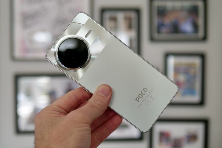 A person holding the Poco F7 Pro.