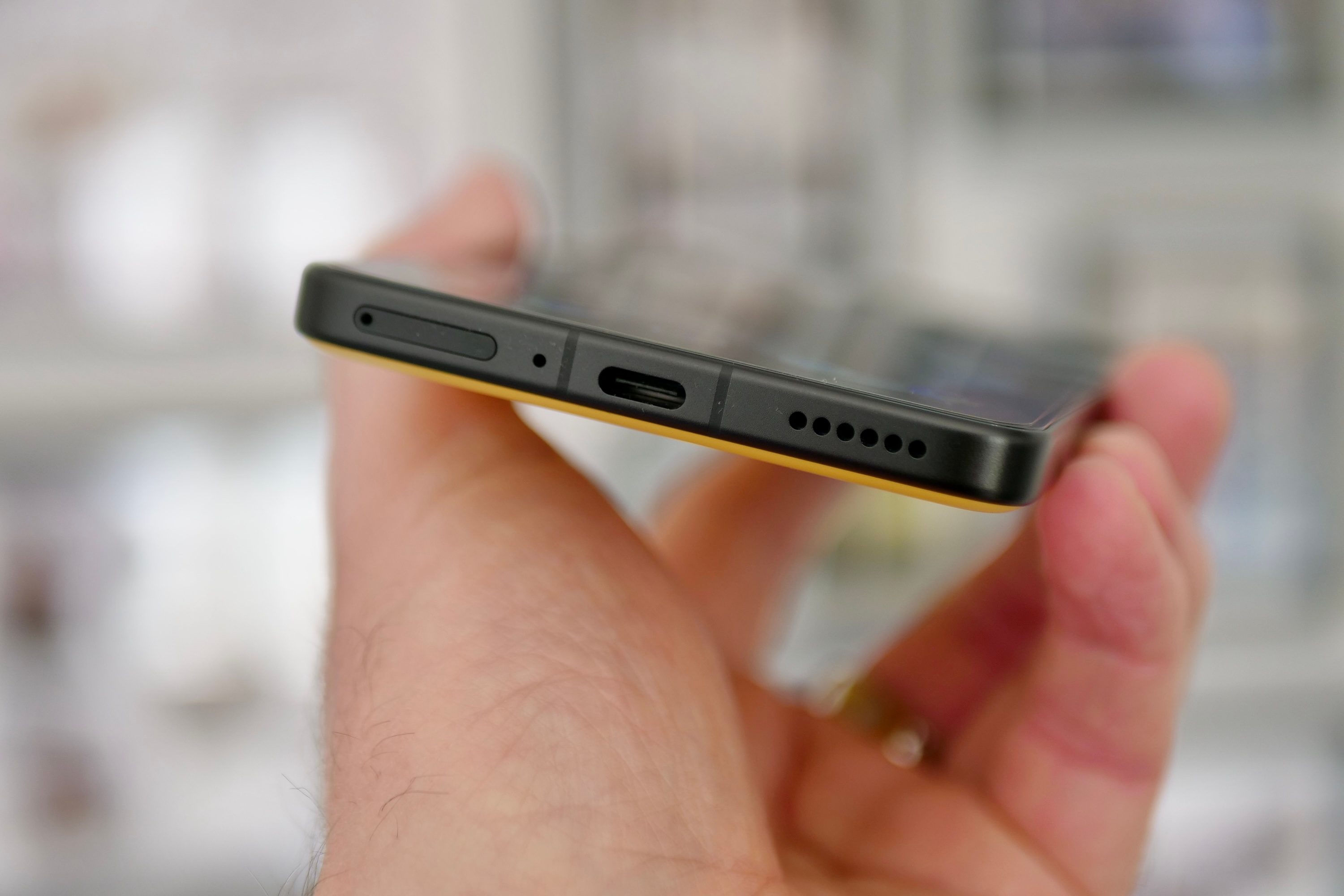 A person holding the Poco F7 Ultra.