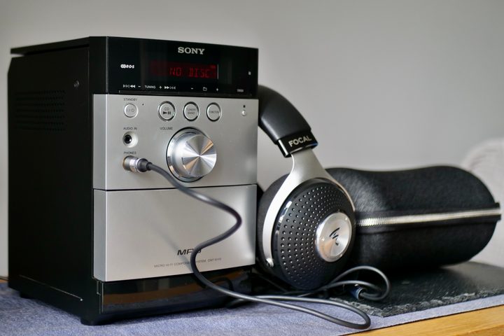A Sony CD player with a pair of headphones next to it.