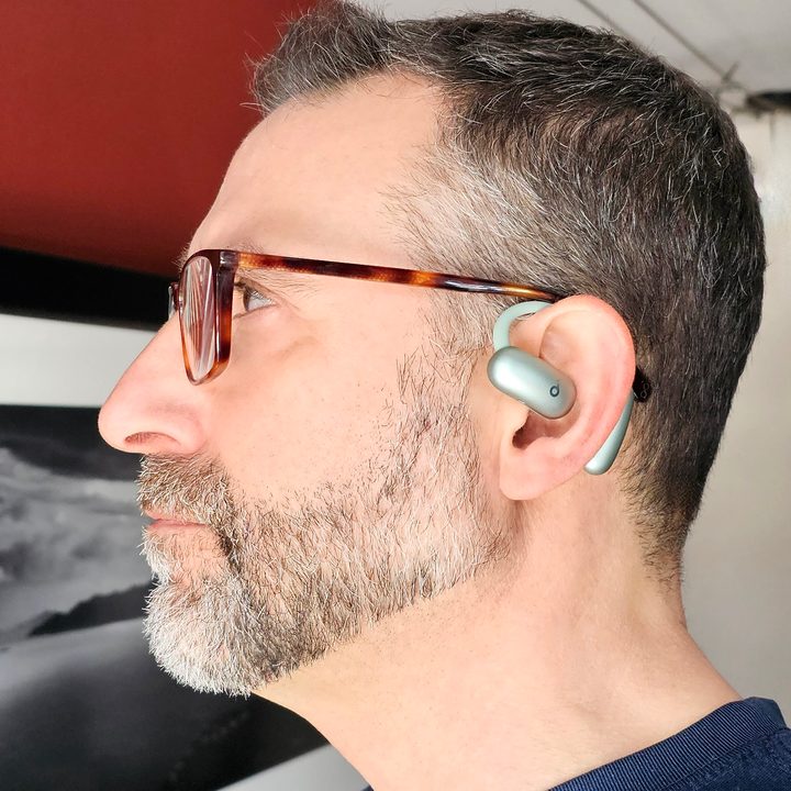 Simon Cohen wearing Soundcore AeroFit 2: side view.