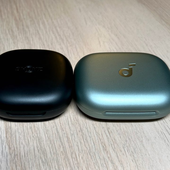 Shokz OpenFit 2 and Soundcore AeroFit 2 charging cases.