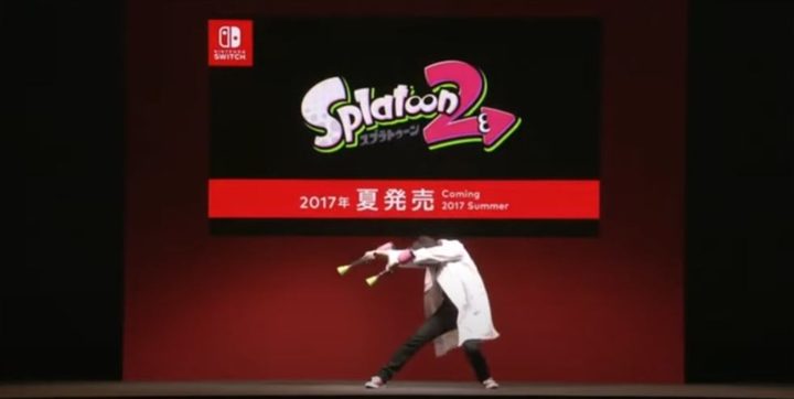 A man presents Splatoon 2 on stage.