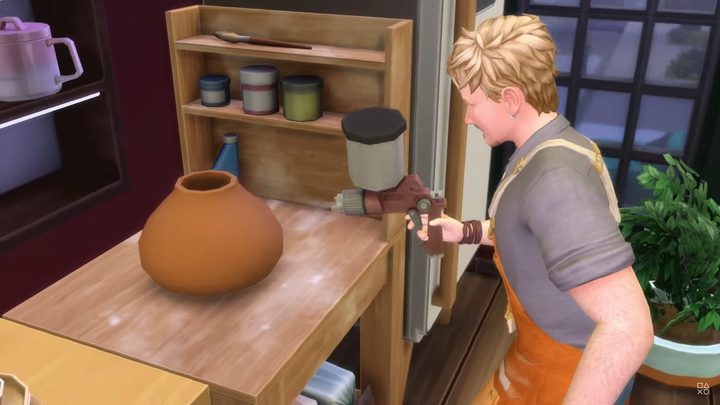 Spraying pottery in The Sims 4 Businesses and Hobbies.