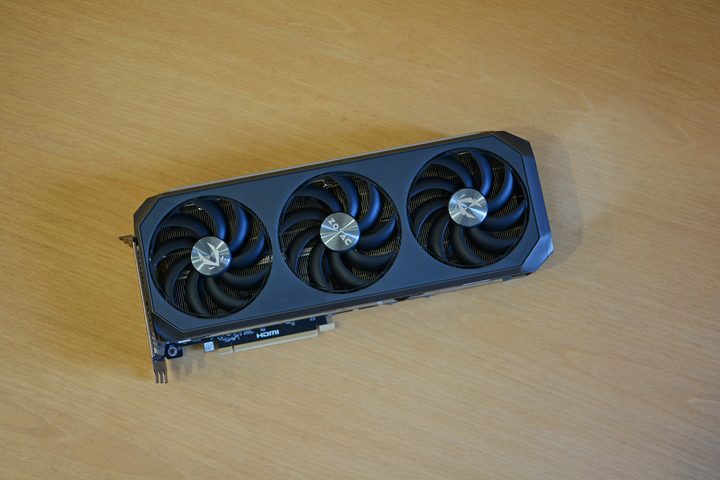 The Zotac RTX 5070 Ti Amp Extreme Infinity graphics card placed on a wooden surface