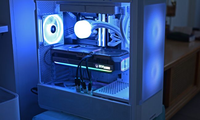 The Zotac RTX 5070 Ti Amp Extreme Infinity plugged into a white gaming PC