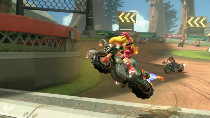 Peach jumping on a motorcyle in Mario Kart World.