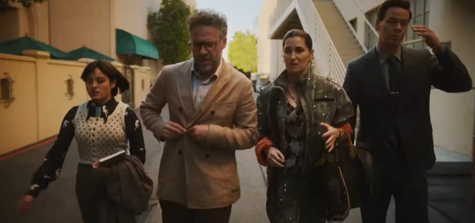 Chase Sui Wonders, Seth Rogen, Kathryn Hahn, and Ike Barinholtz walking together in "The Studio."