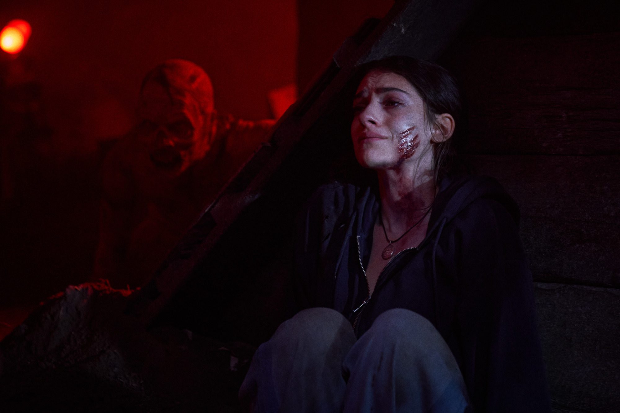 Clover hiding from a Wendigo in Until Dawn.