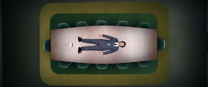 Mark S lying on a table in Lumon in "Severance."