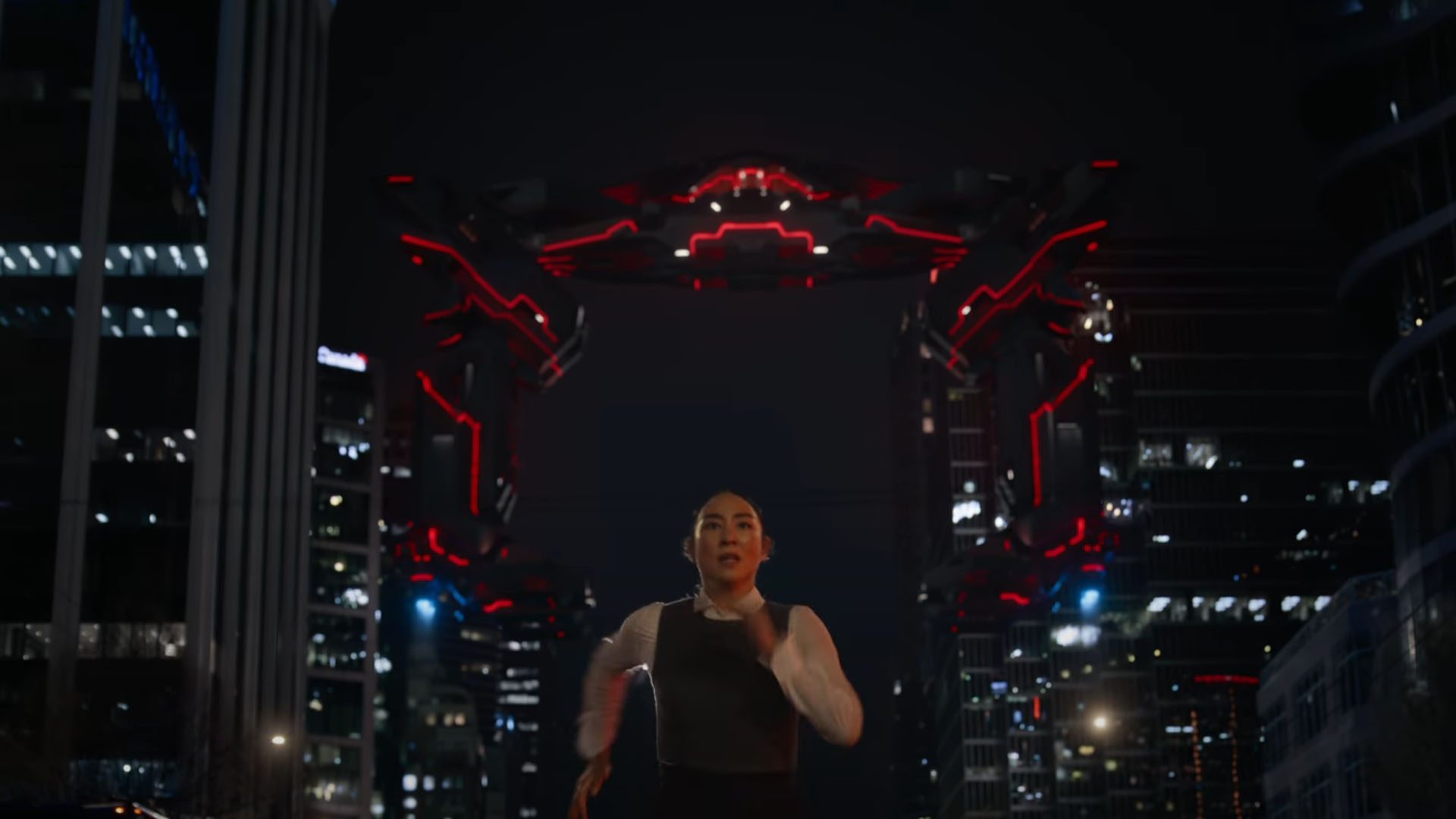 Greta Lee runs from a Recognizer in Tron: Ares.