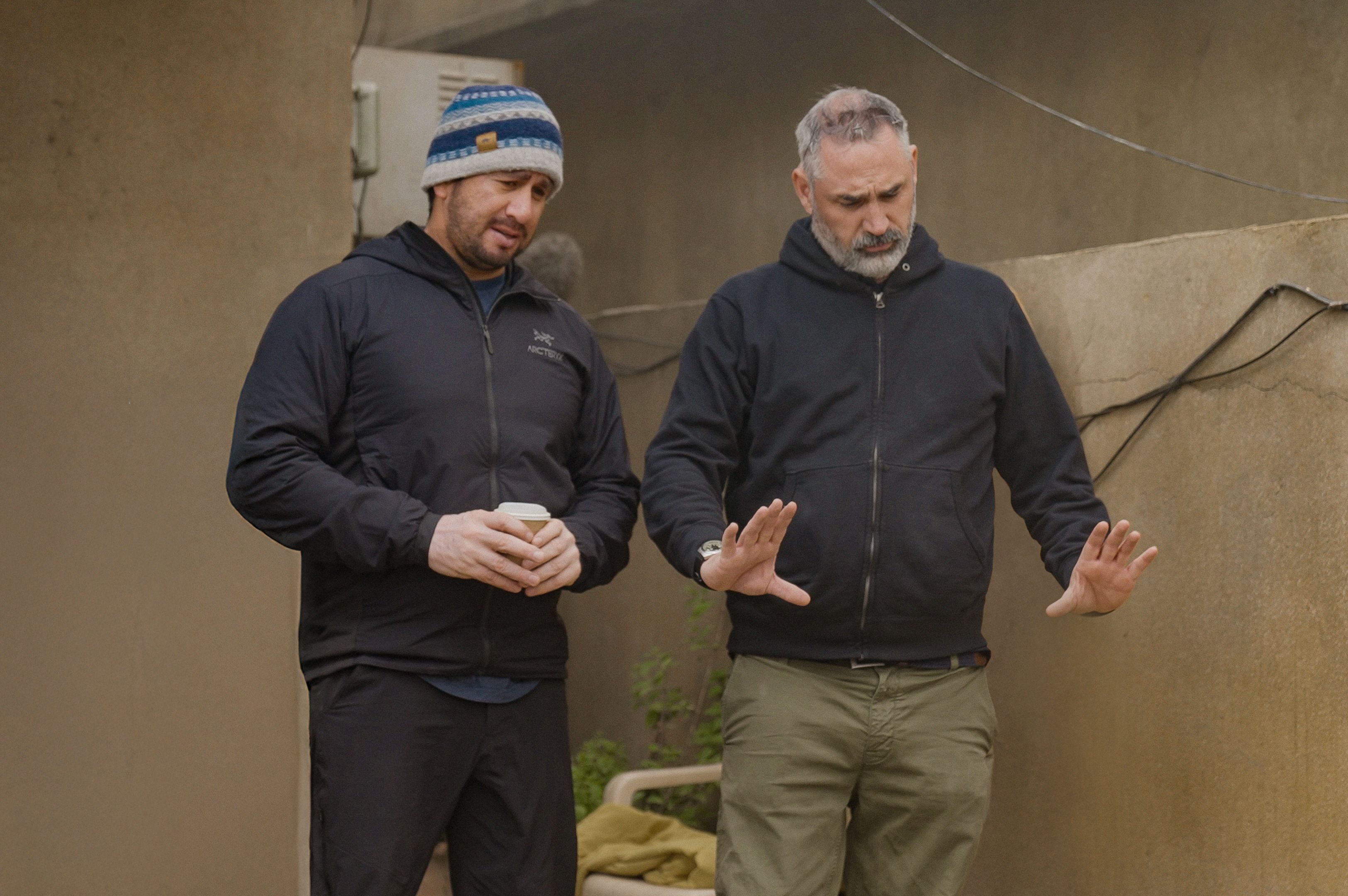 Two men direct a scene in Warfare.