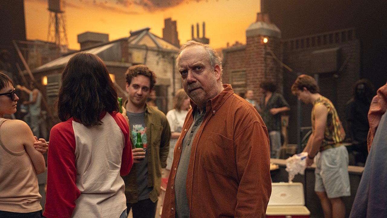 A man stands in the middle of an old photo in a scene from Black Mirror's episode Eulogy.