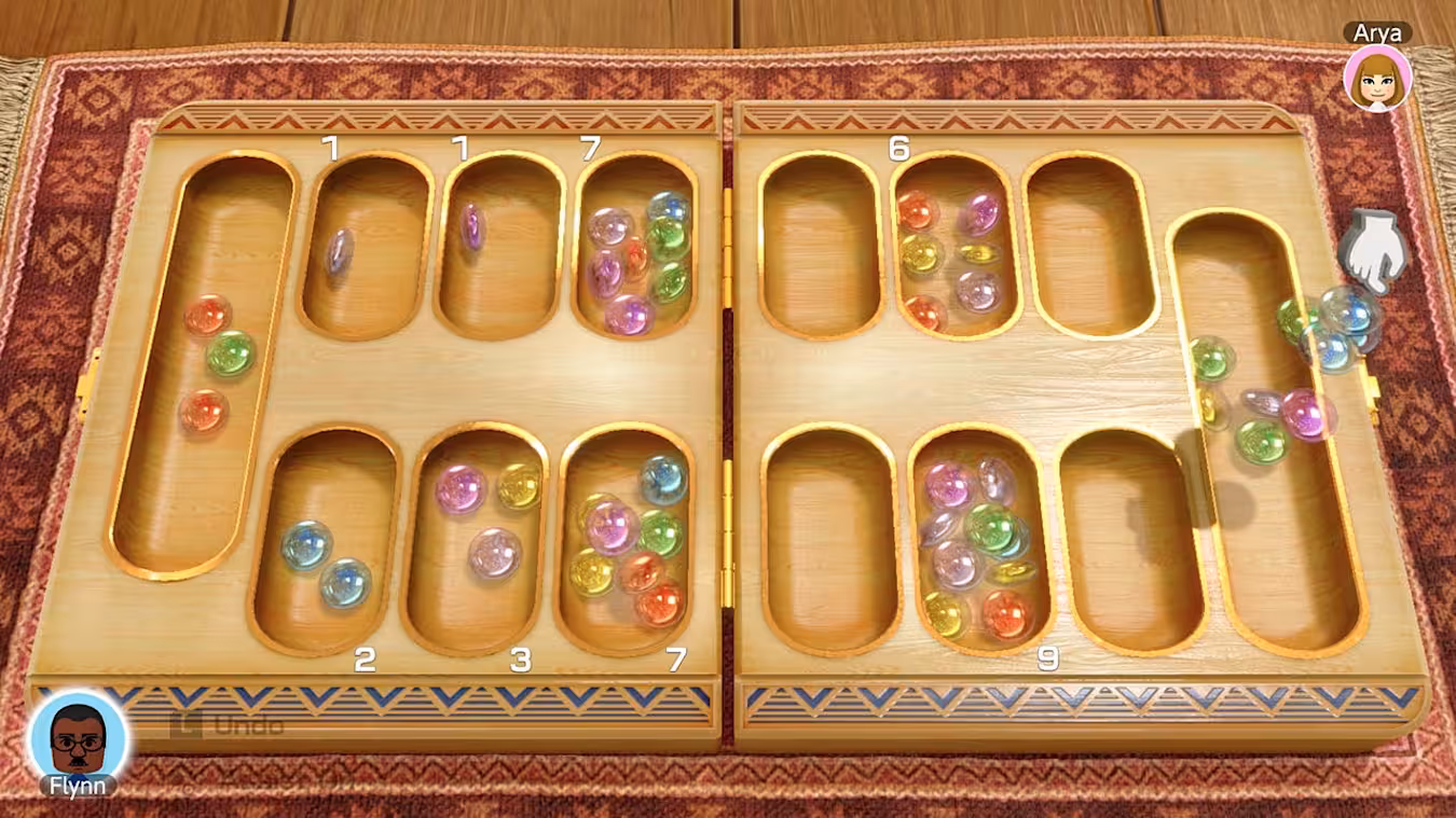 A mancala board appears in Clubhouse Games: 51 Worldwide Classics.