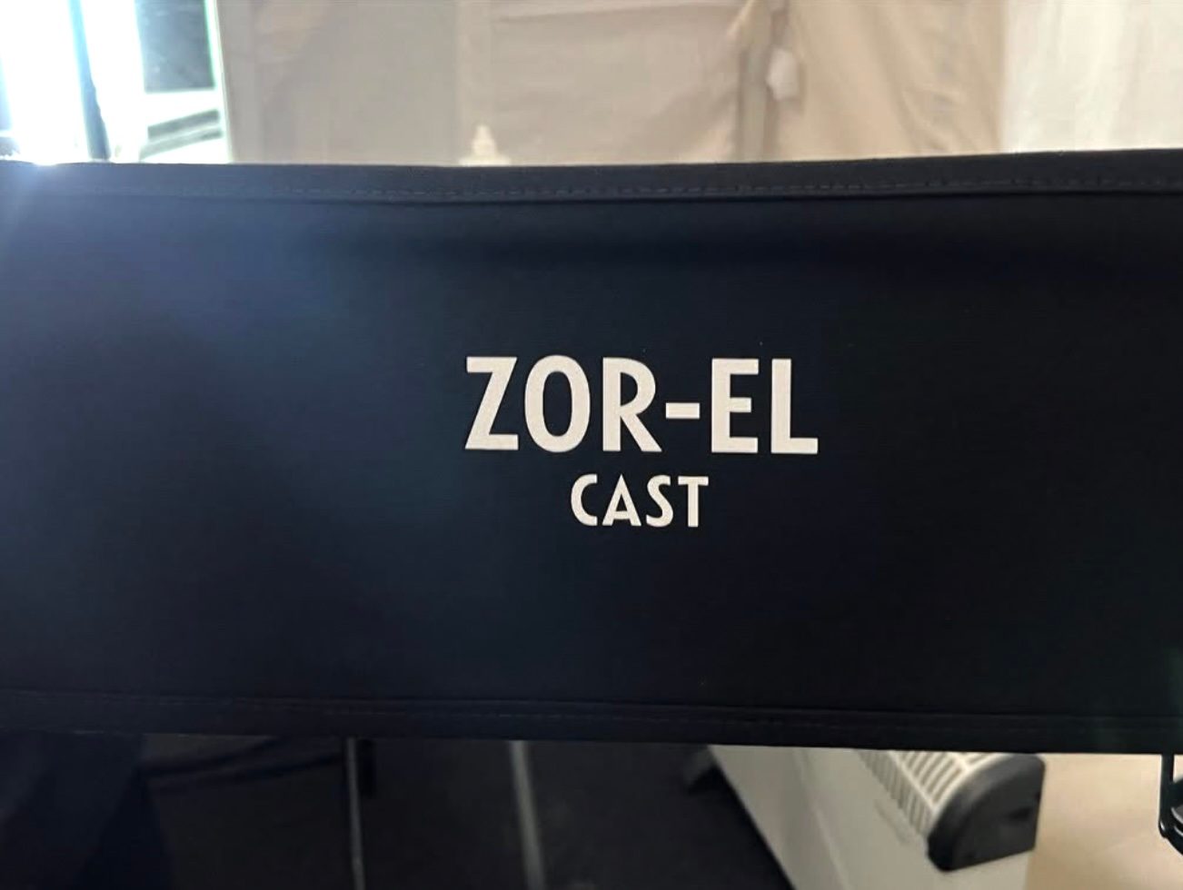 A chair with Zor-El on it.