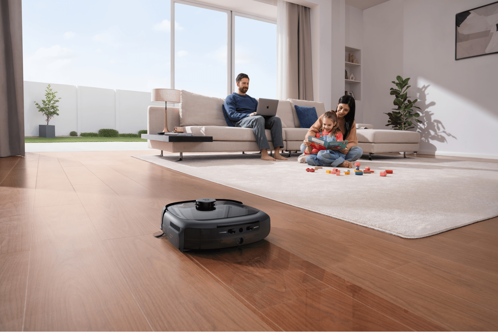 A family watching a eufy robot vacuum.