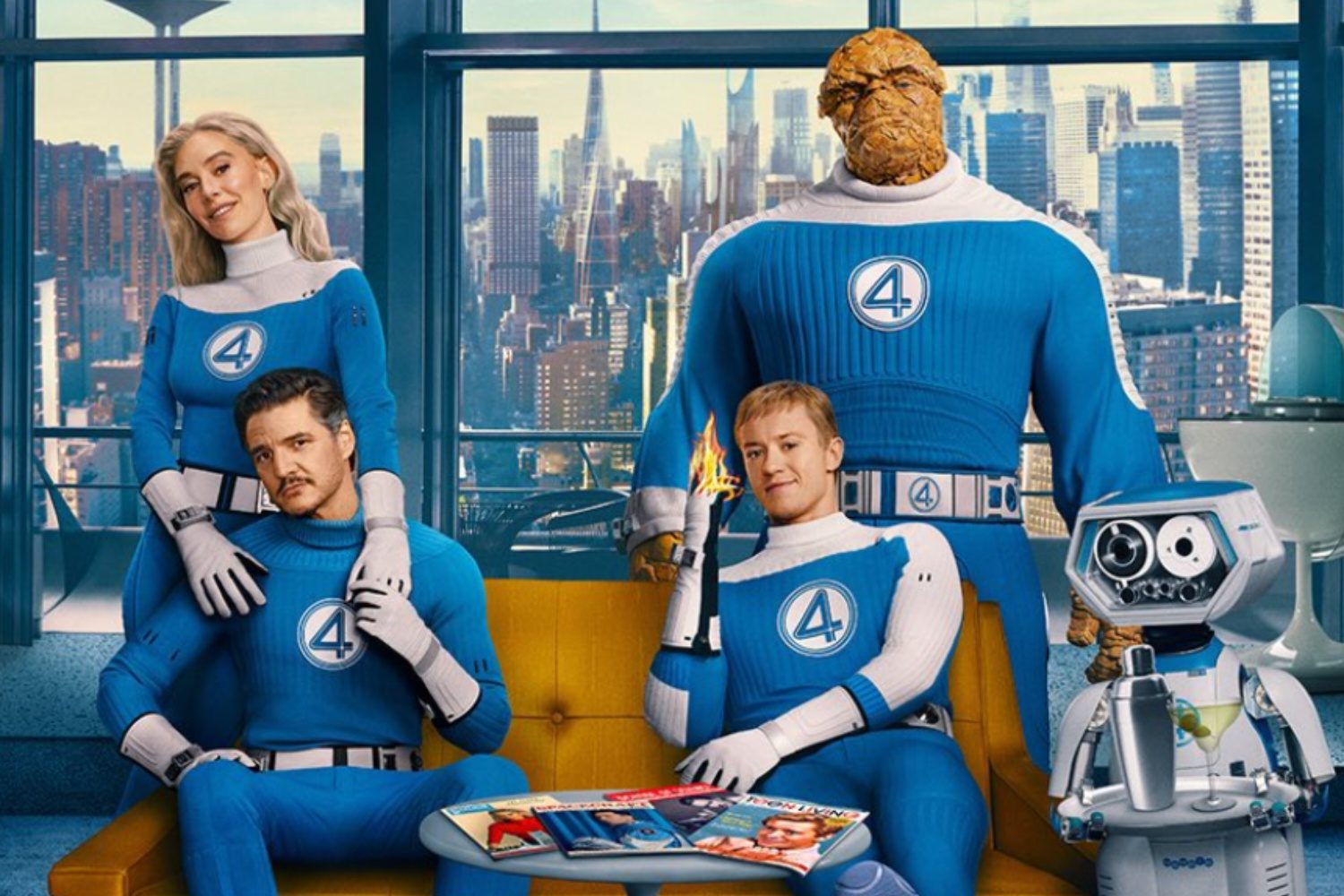 The Fantastic Four pose for a picture while sitting on a couch.