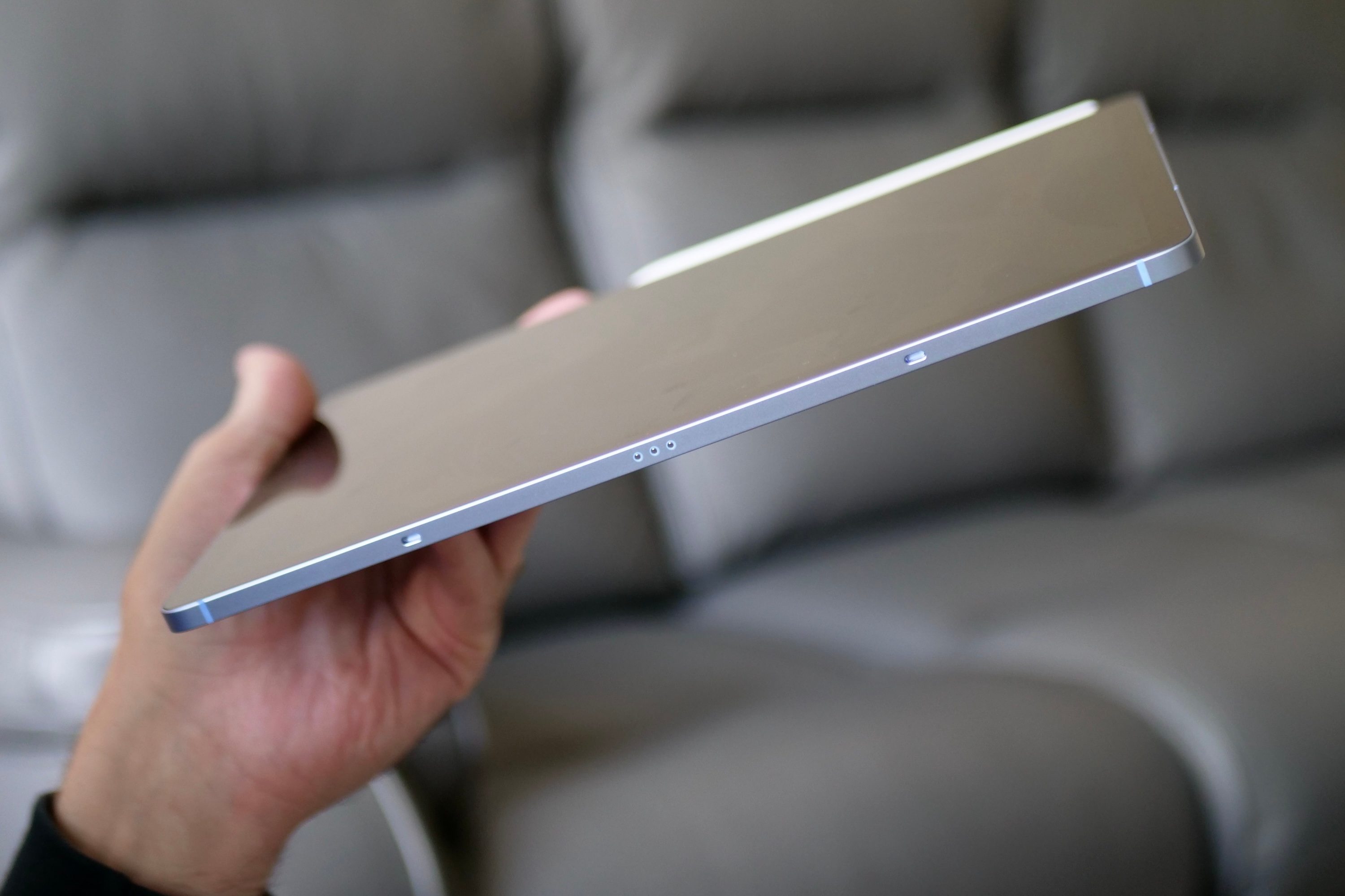 A person holding the Samsung Galaxy Tab S10 FE.