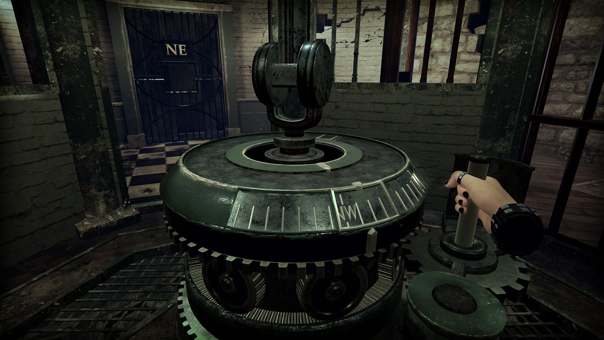 A hand turns a crank in Ghost Town.