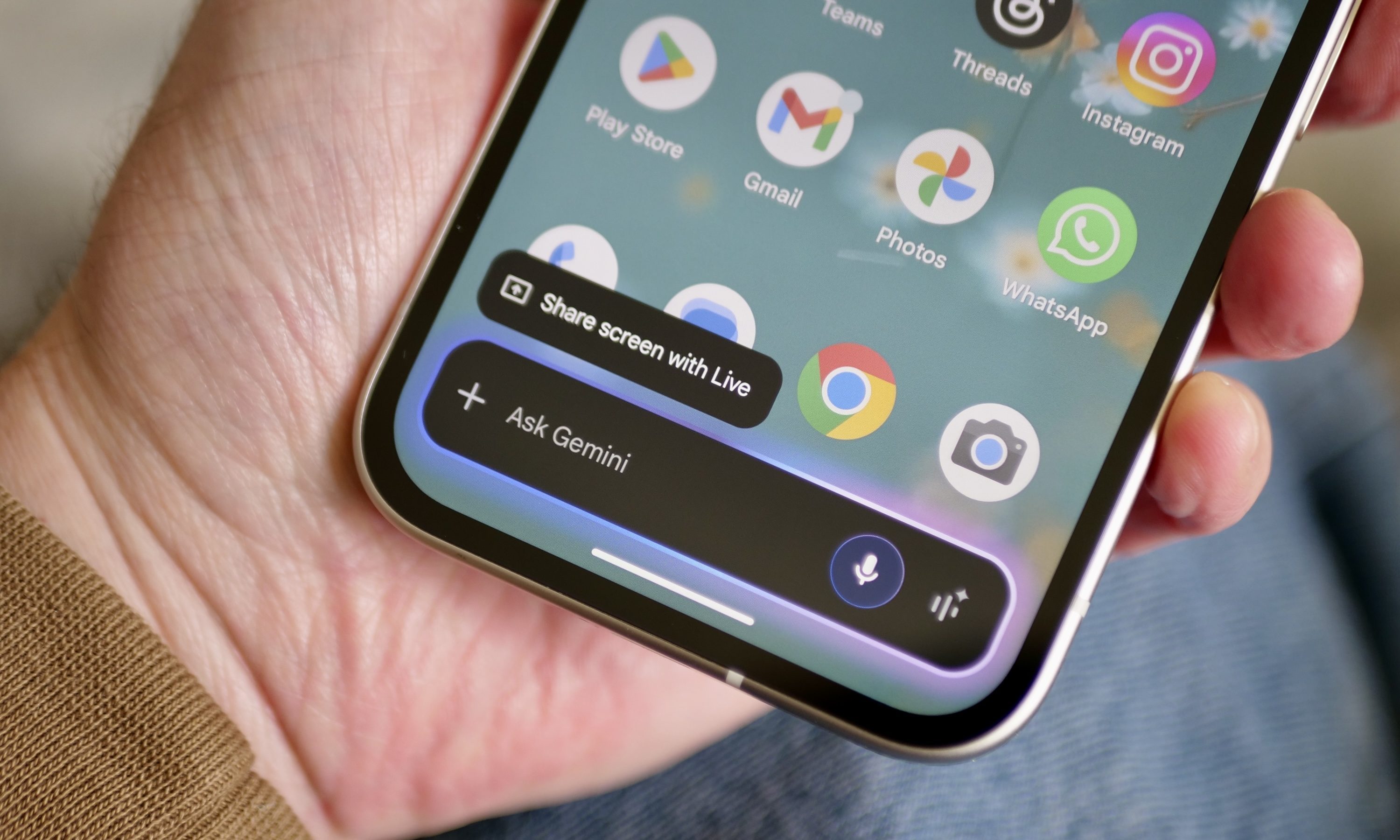 A person using Google Gemini on the Google Pixel 9a.