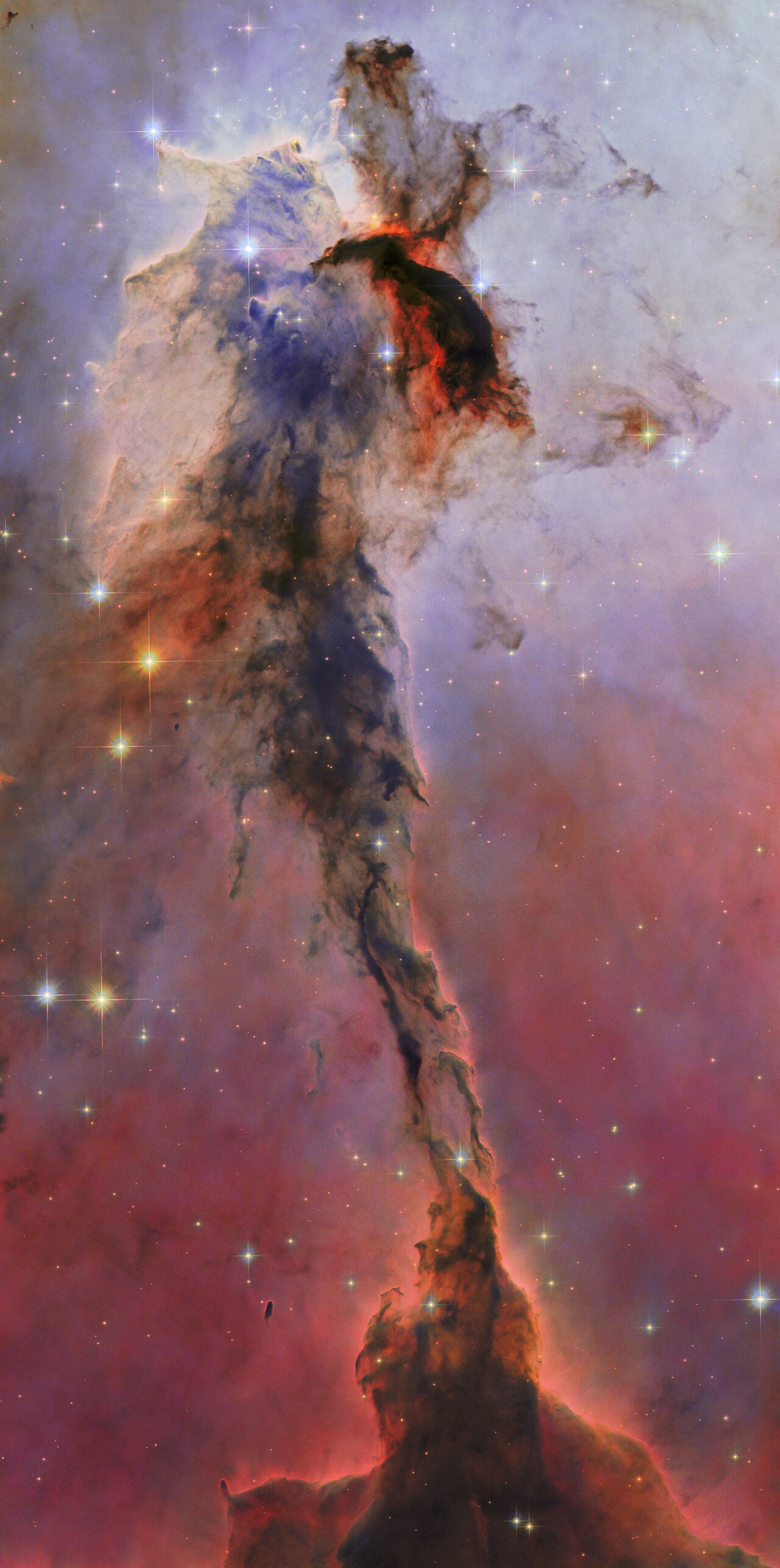 This towering structure of billowing gas and dark, obscuring dust might only be a small portion of the Eagle Nebula, but it is no less majestic in appearance for it. 9.5 light-years tall and 7000 light-years distant from Earth, this dusty sculpture is refreshed with the use of new processing techniques. The new Hubble image is part of ESA/Hubble’s 35th anniversary celebrations.