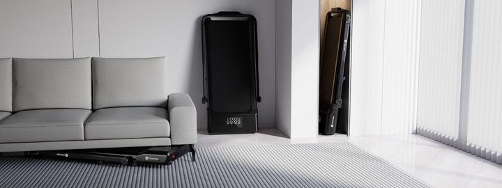 Treadmill folded in corner of room