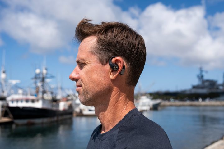 The JLab Epic Open Sport earphones on a man.