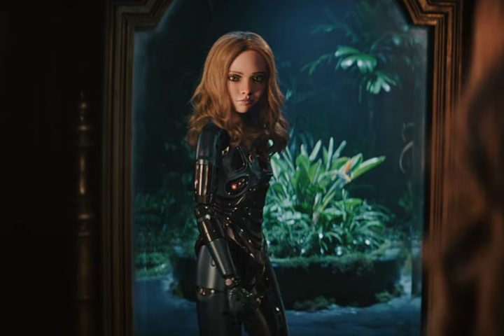 A robot looks into the mirror and smirks.