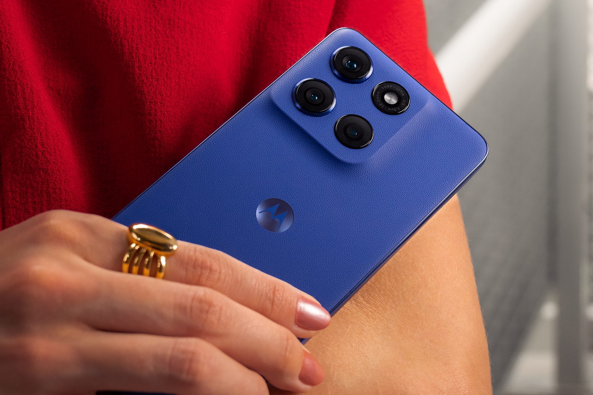 A promotional images showing a person holding the Motorola Moto G Stylus 2025.