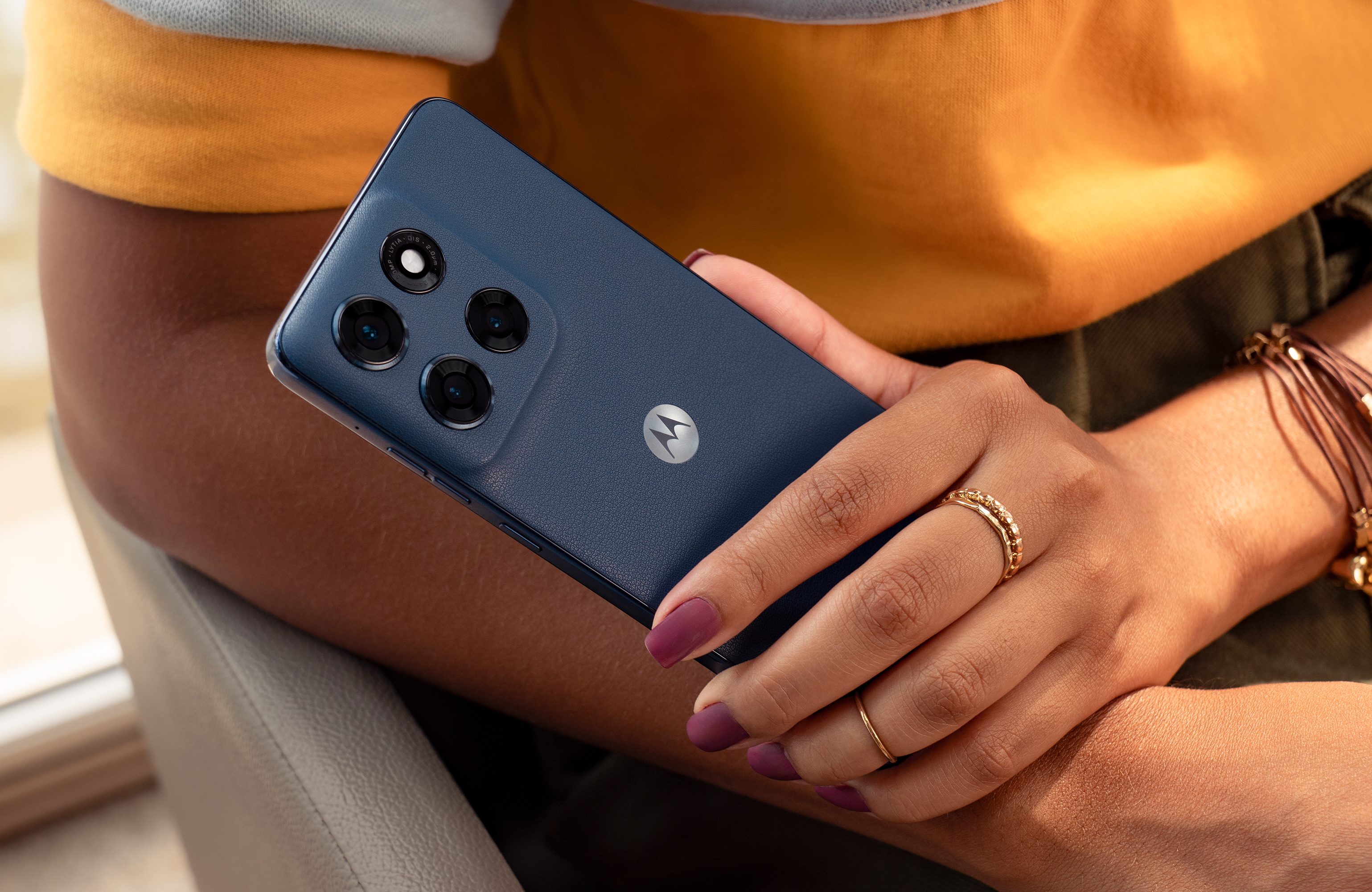 A promotional images showing a person holding the Motorola Moto G Stylus 2025.