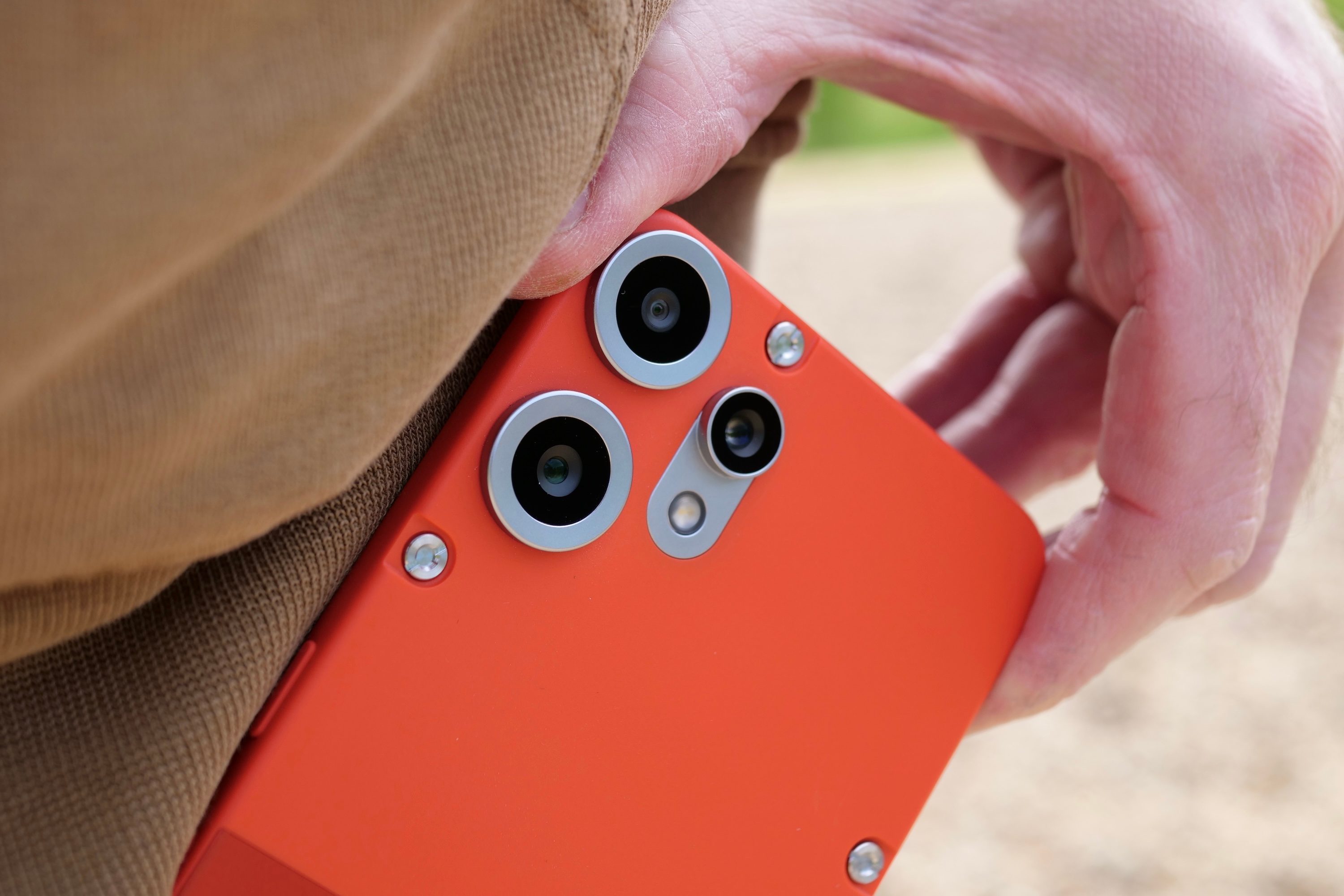 A person taking the Nothing CMF Phone 2 Pro out of a pocket.
