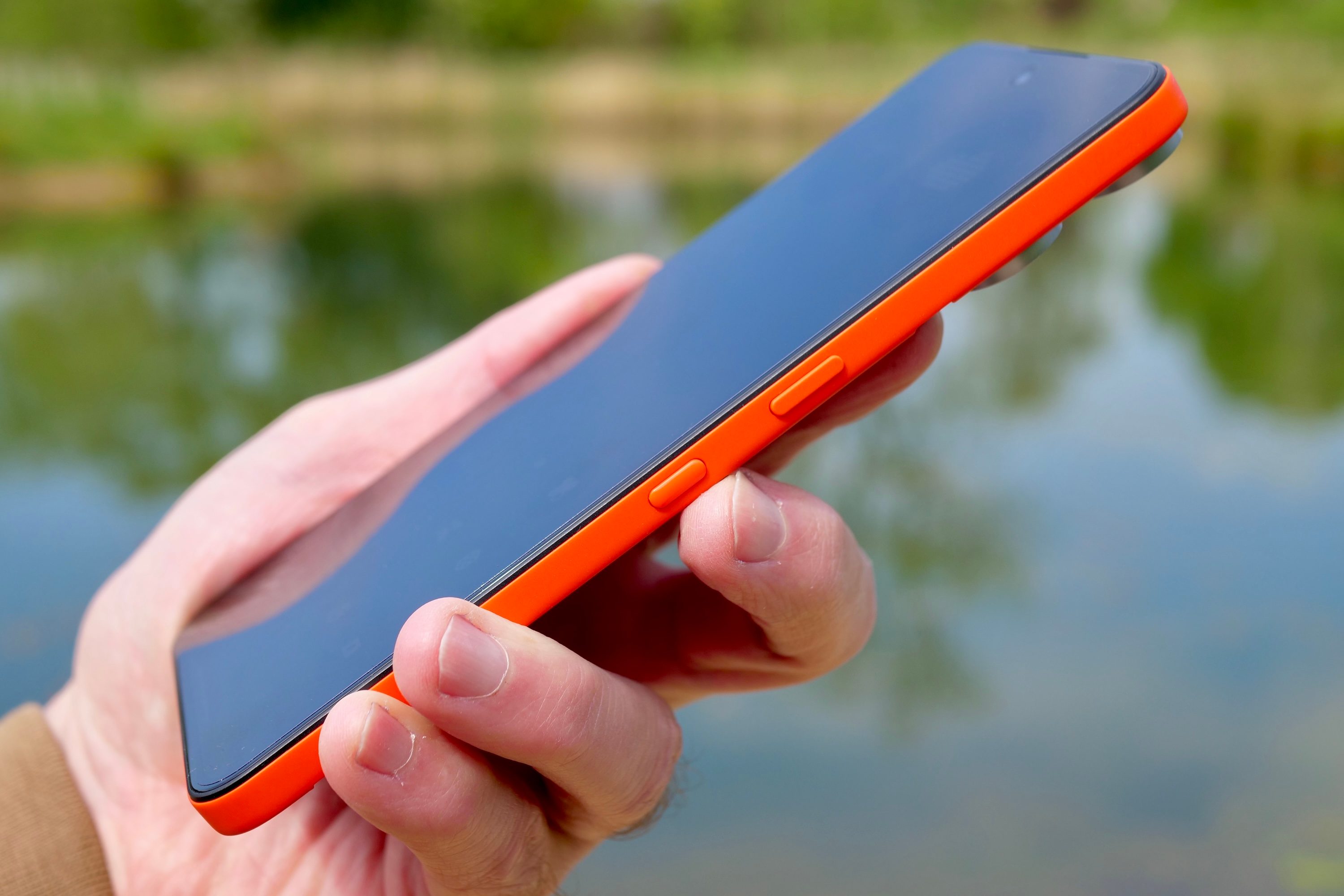 A person holding the Nothing CMF Phone 2 Pro.