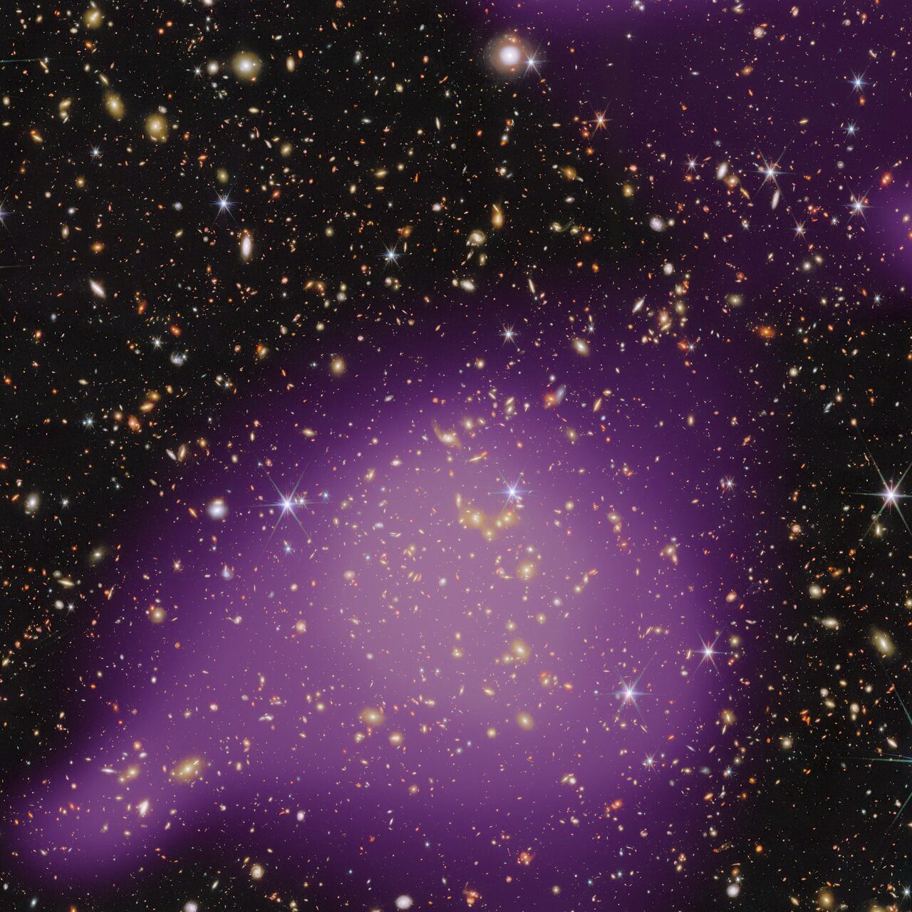 This image combines infrared data from Webb’s Near-InfraRed Camera (NIRCam) instrument with further infrared observations from the Hubble Space Telescope. The X-ray data, shown in purple, highlights the presence of hot gas concentrated within the X-ray galaxy group. These X-ray data come from ESA’s XMM-Newton space observatory, with contributions from NASA’s Chandra X-ray Observatory.