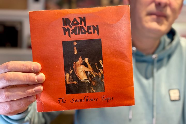 A person holding a vinyl record.