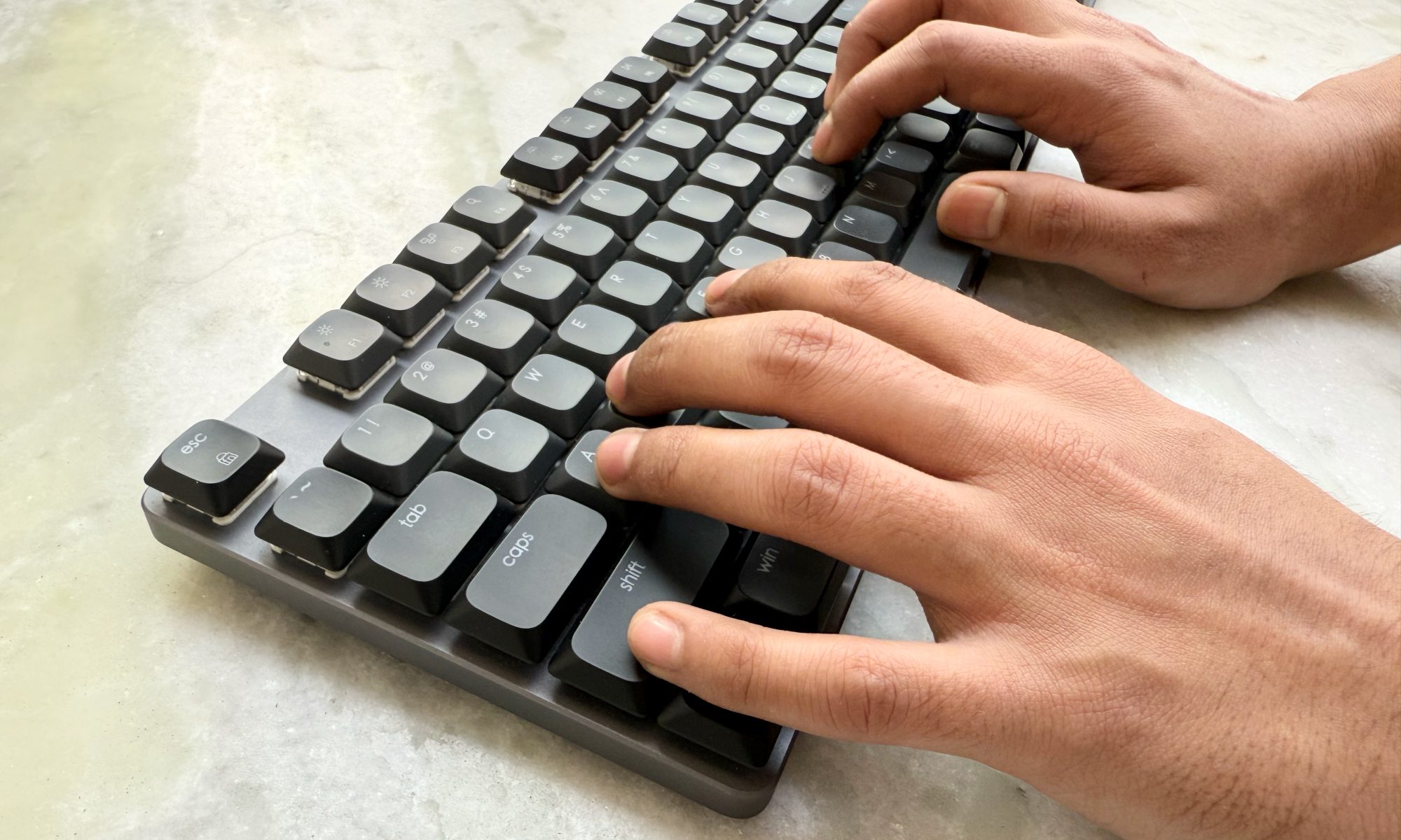 Person typing on the Satechi SM3 Slim mechanical keyboard.
