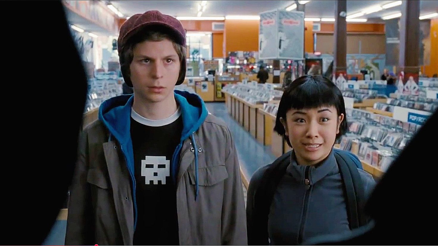 A scene from Scott Pilgrim vs. the World with Scott and Knives standing in Sonic Boom Records in Toronto.