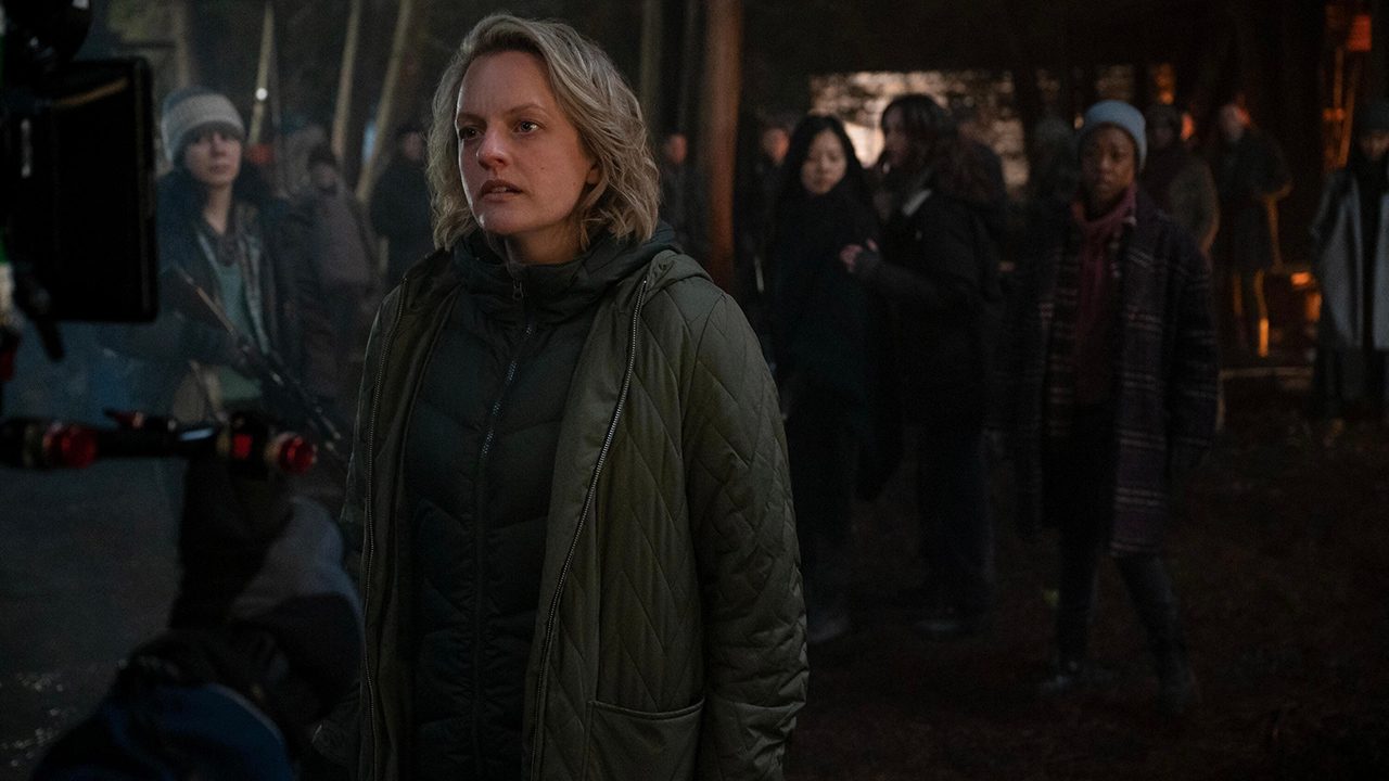 June standing in front of a group of others in The Handmaid's Tale.