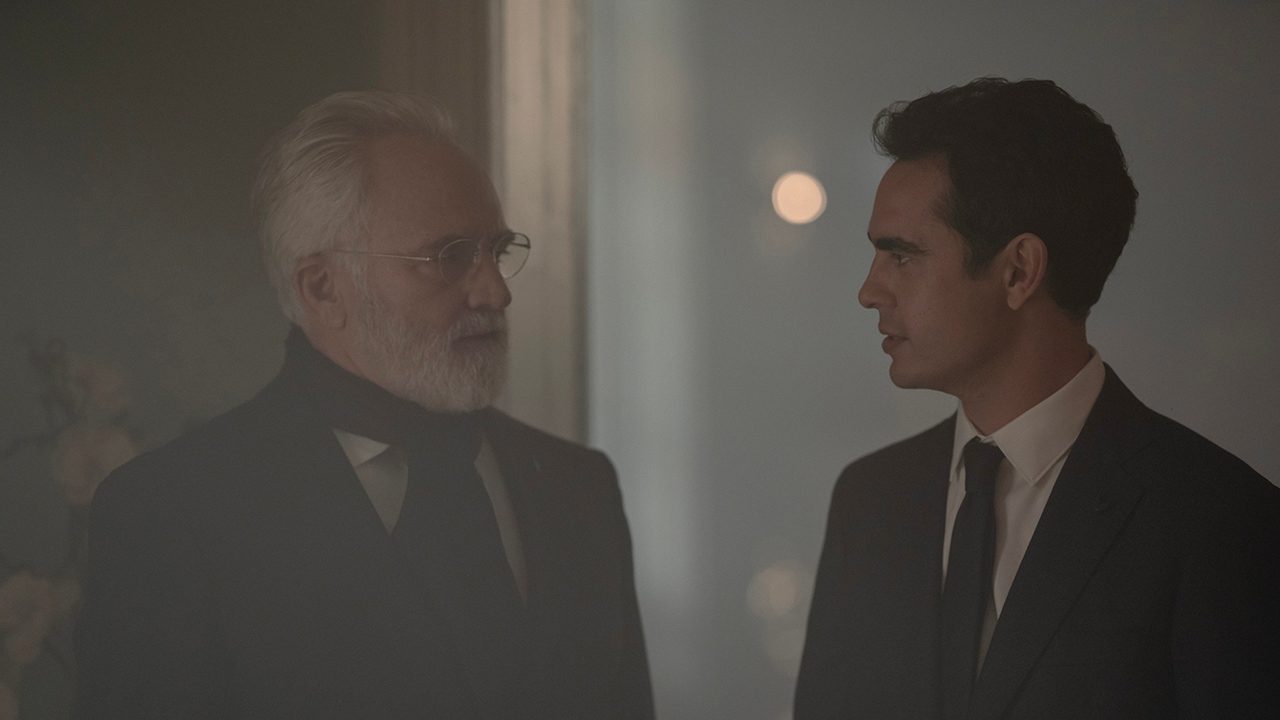 Commander Lawrence and Nick looking at one another in The Handmaid's Tale.