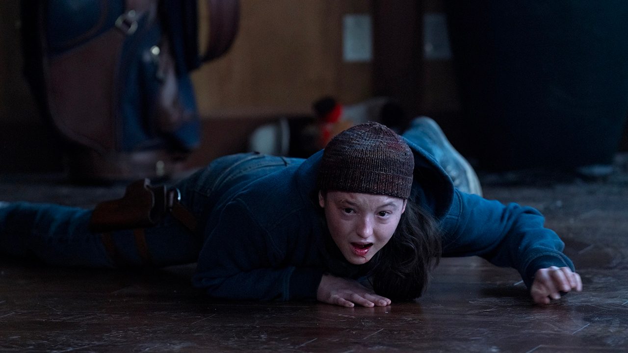 Ellie lying on the ground screaming in The Last of Us.