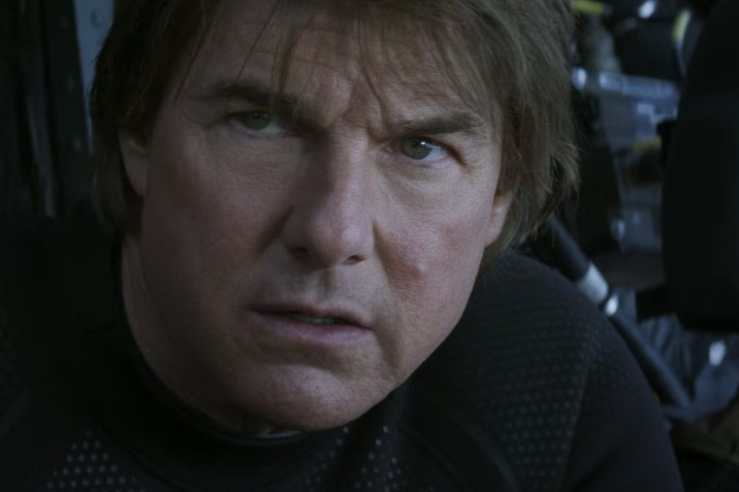 Tom Cruise looks out with a determined face in Mission: Impossible - The Final Reckoning.