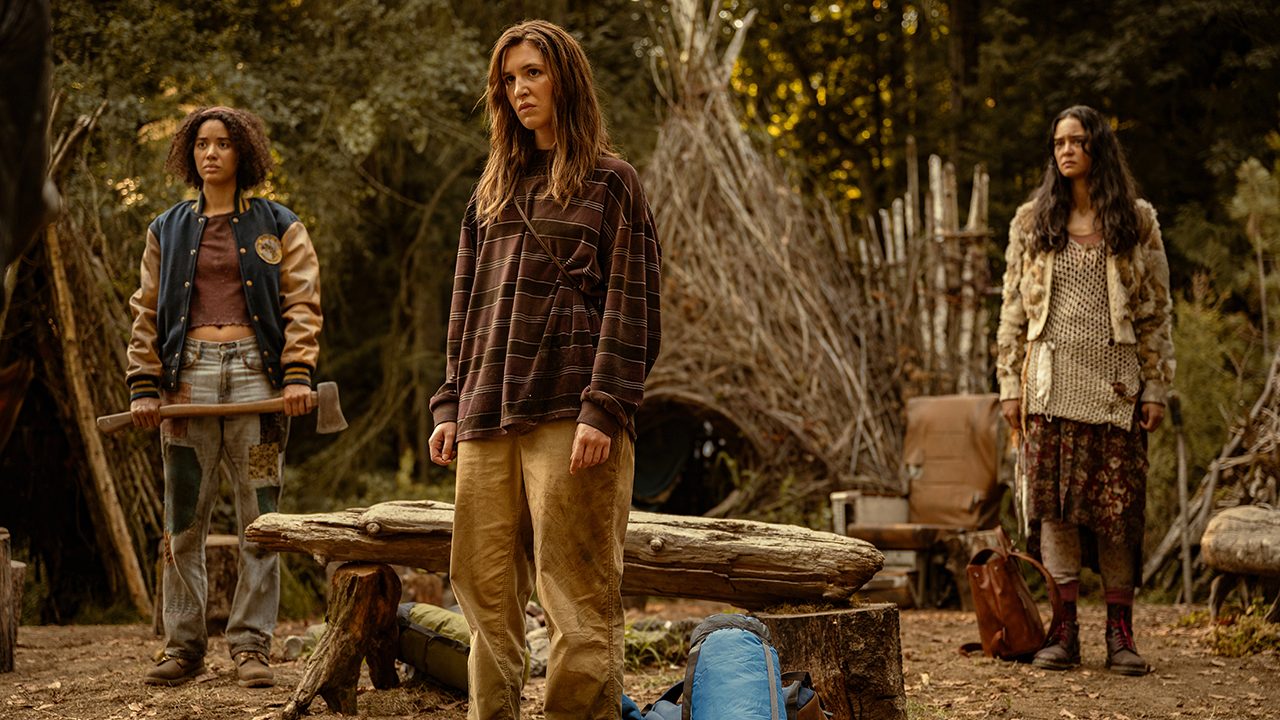 Tai, Shauna, and Lottie stand outside in the wilderness in Yellowjackets.