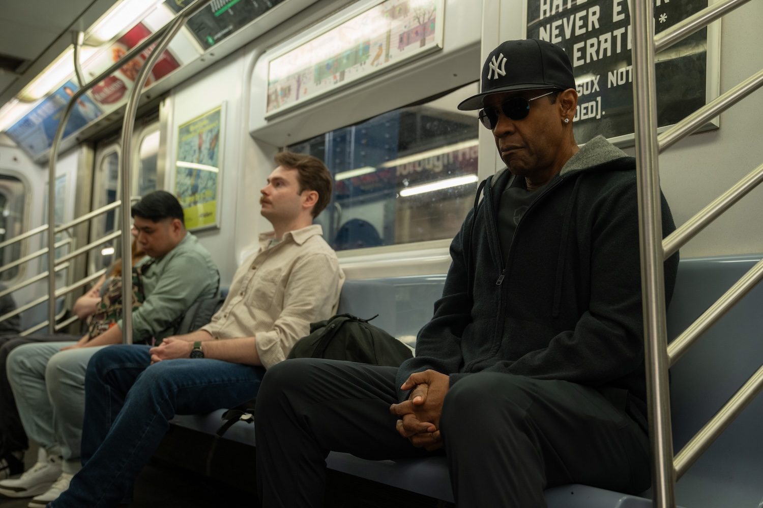Denzel Washington sits on the subway in Highest 2 Lowest.