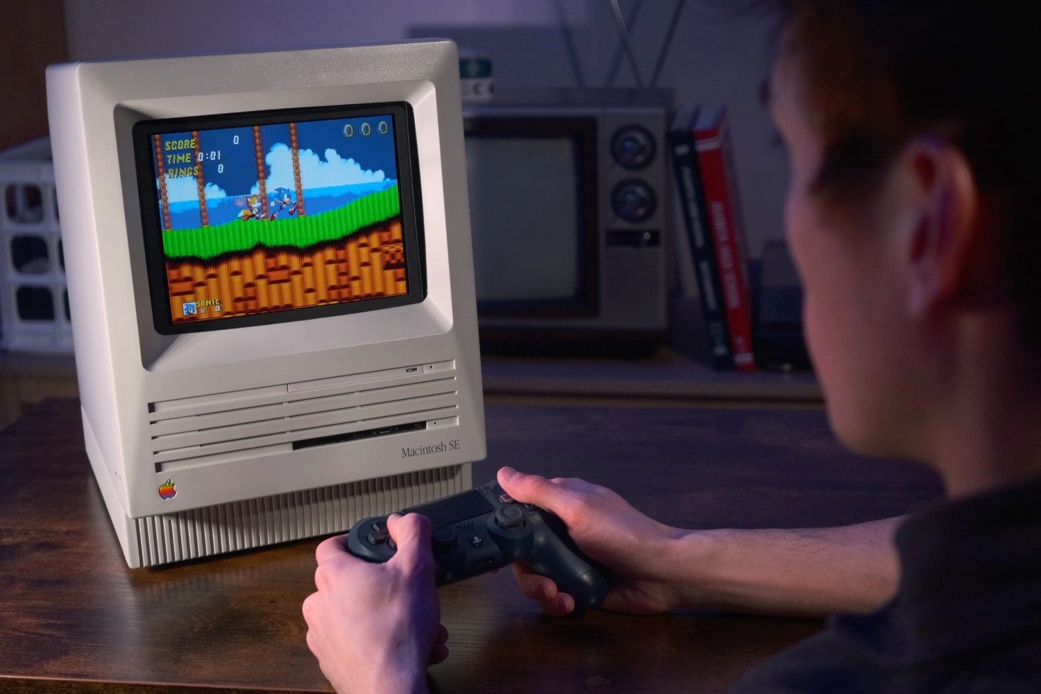 The "Joshintosh," a custom PC built inside a 1980s Macintosh SE case, on a desk.
