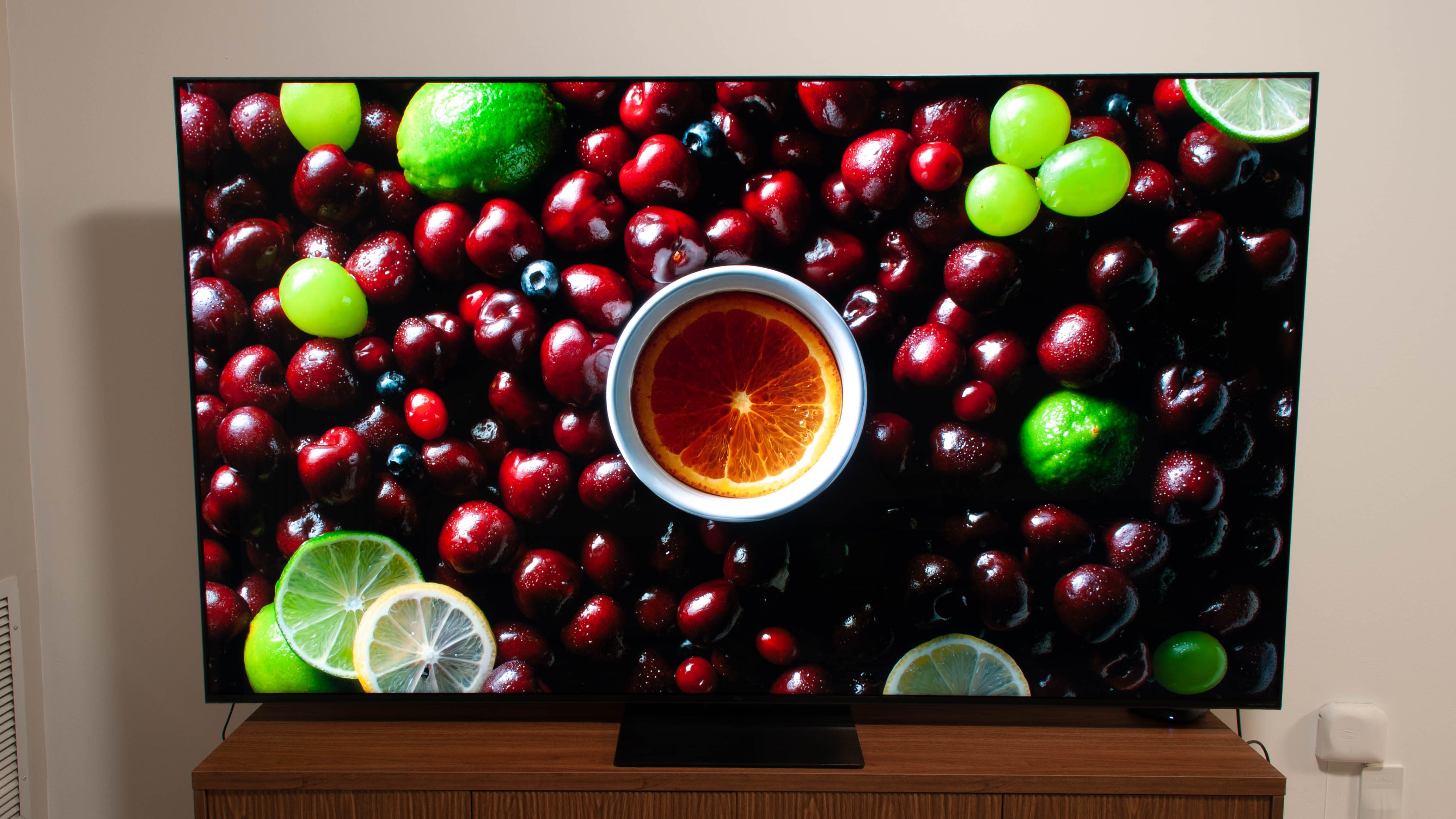The TCL QM7K Series displaying a fruit arrangement.