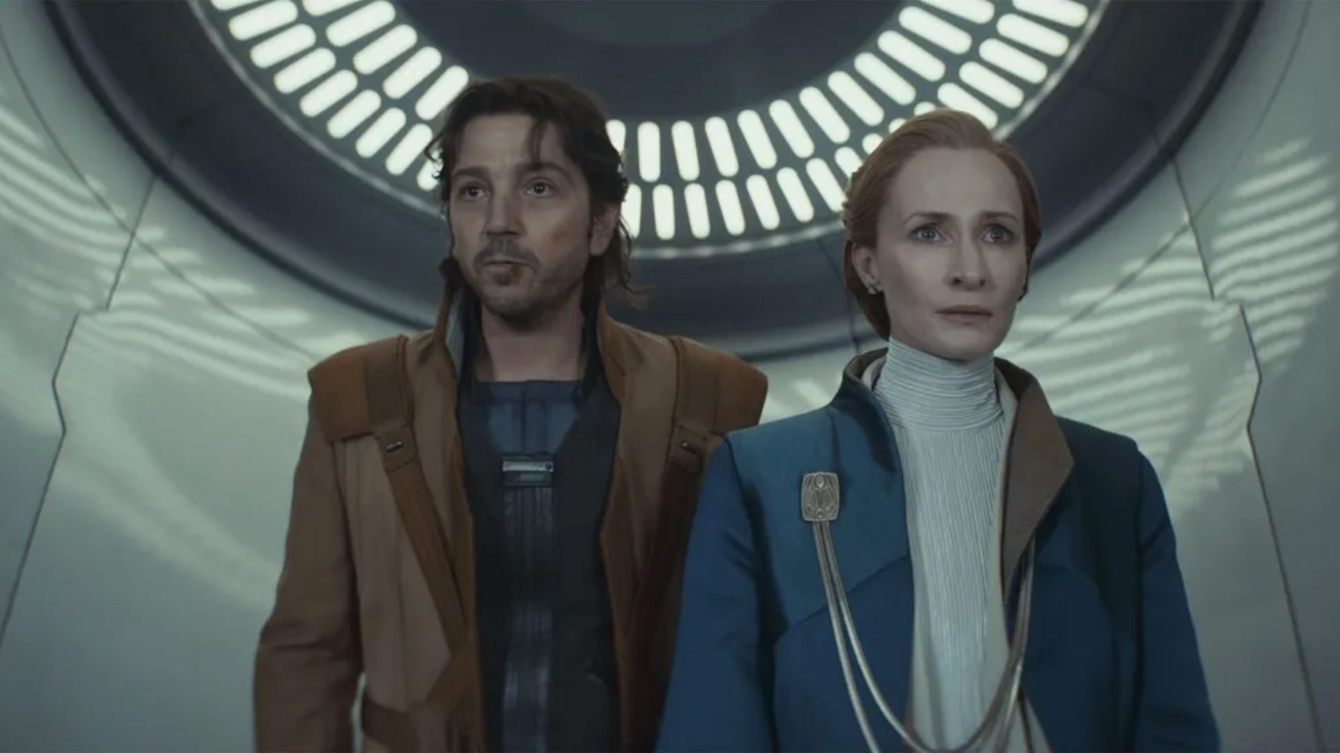 Cassian escorts Mon Mothma out of the senate in Andor season 2.