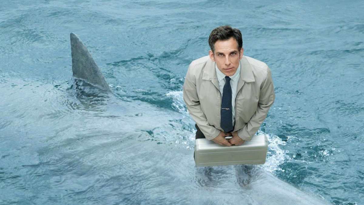 Ben Stiller stands on a shark in The Secret Life of Walter Mitty.