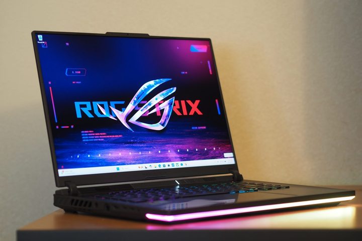 Asus ROG Strix G16 front angled view showing display and RGB lighting.