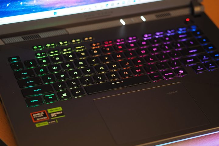 Asus ROG Strix G16 top down view showing keyboard and RGB lighting.