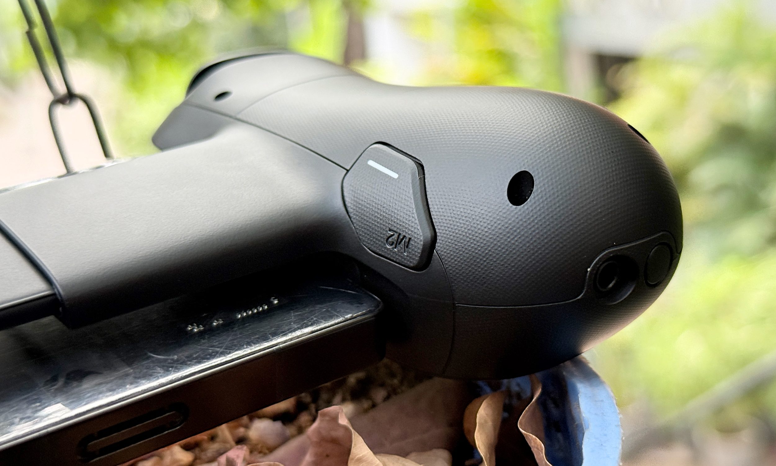 Rear button on Backbone Pro controller.