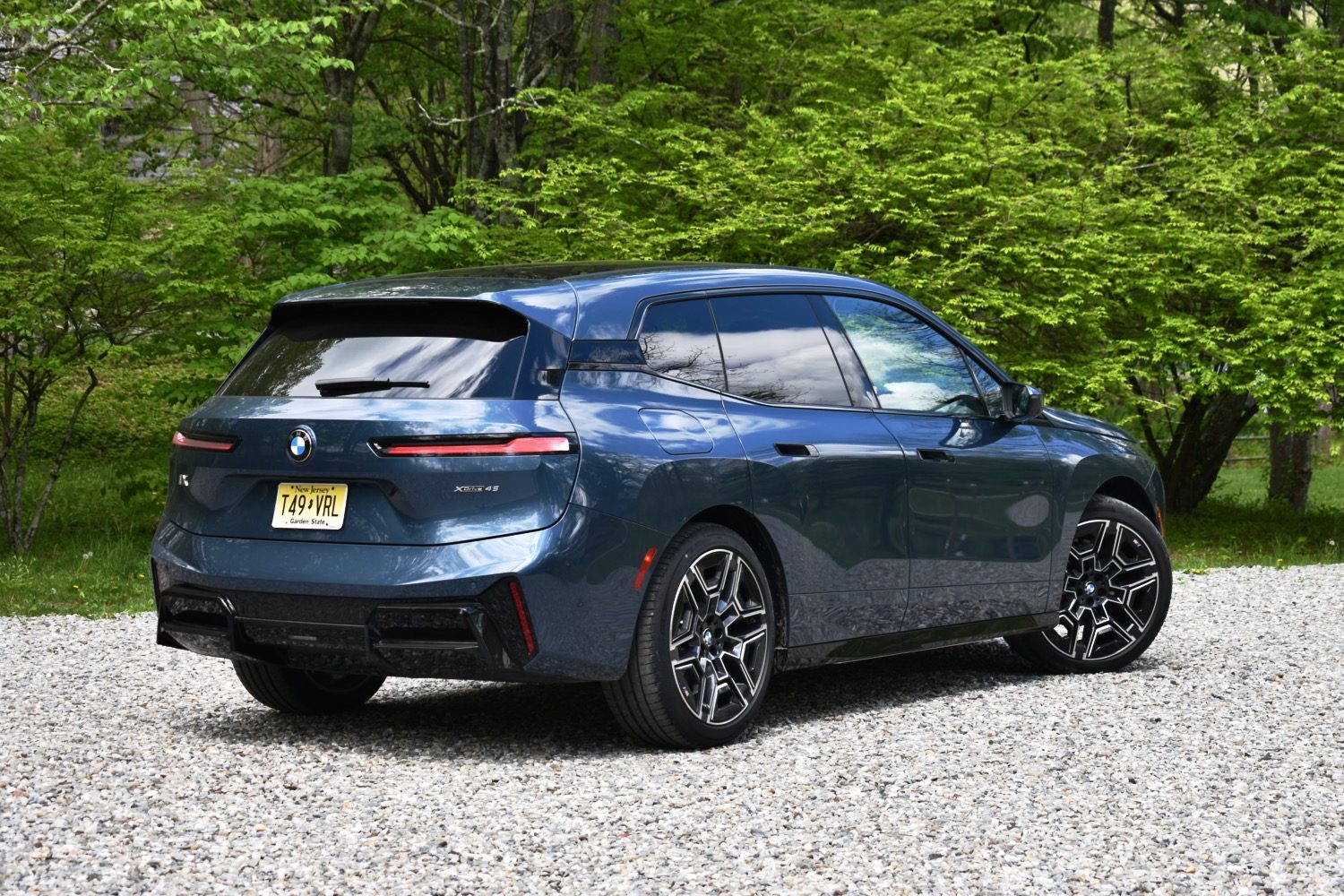 2026 BMW iX rear quarter view.